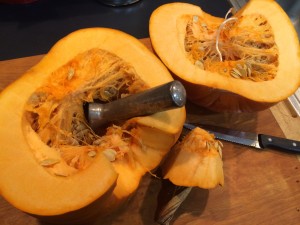 Remove the strings and seeds with an ice cream scoop.