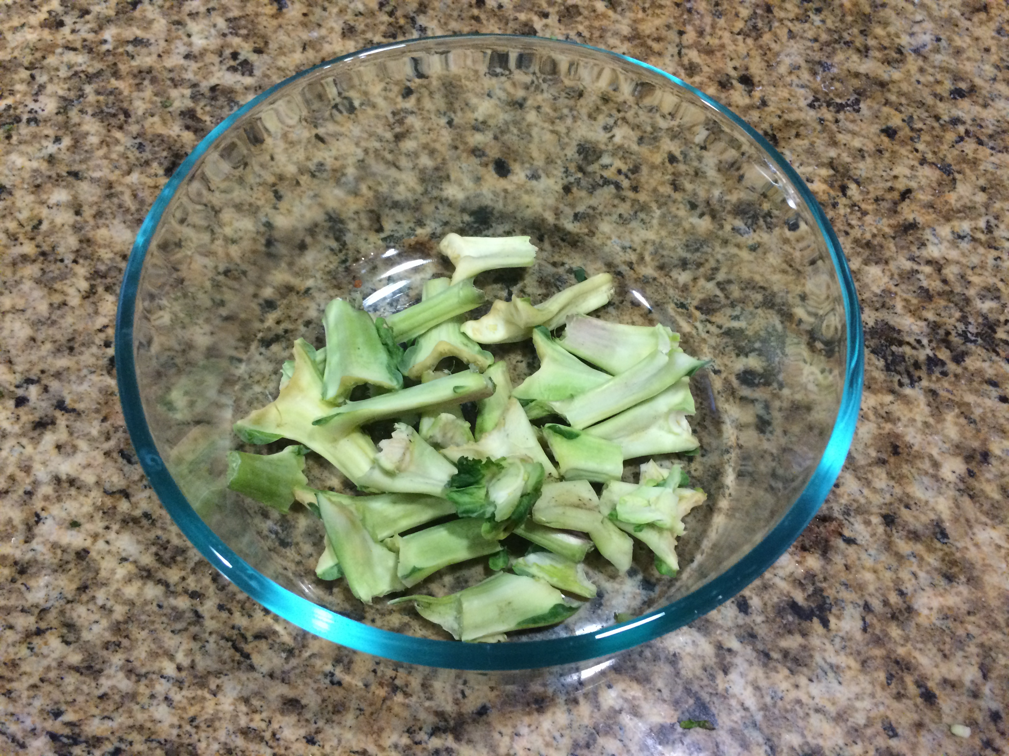 Tender green shoots from the top of a Brussels sprout stalk