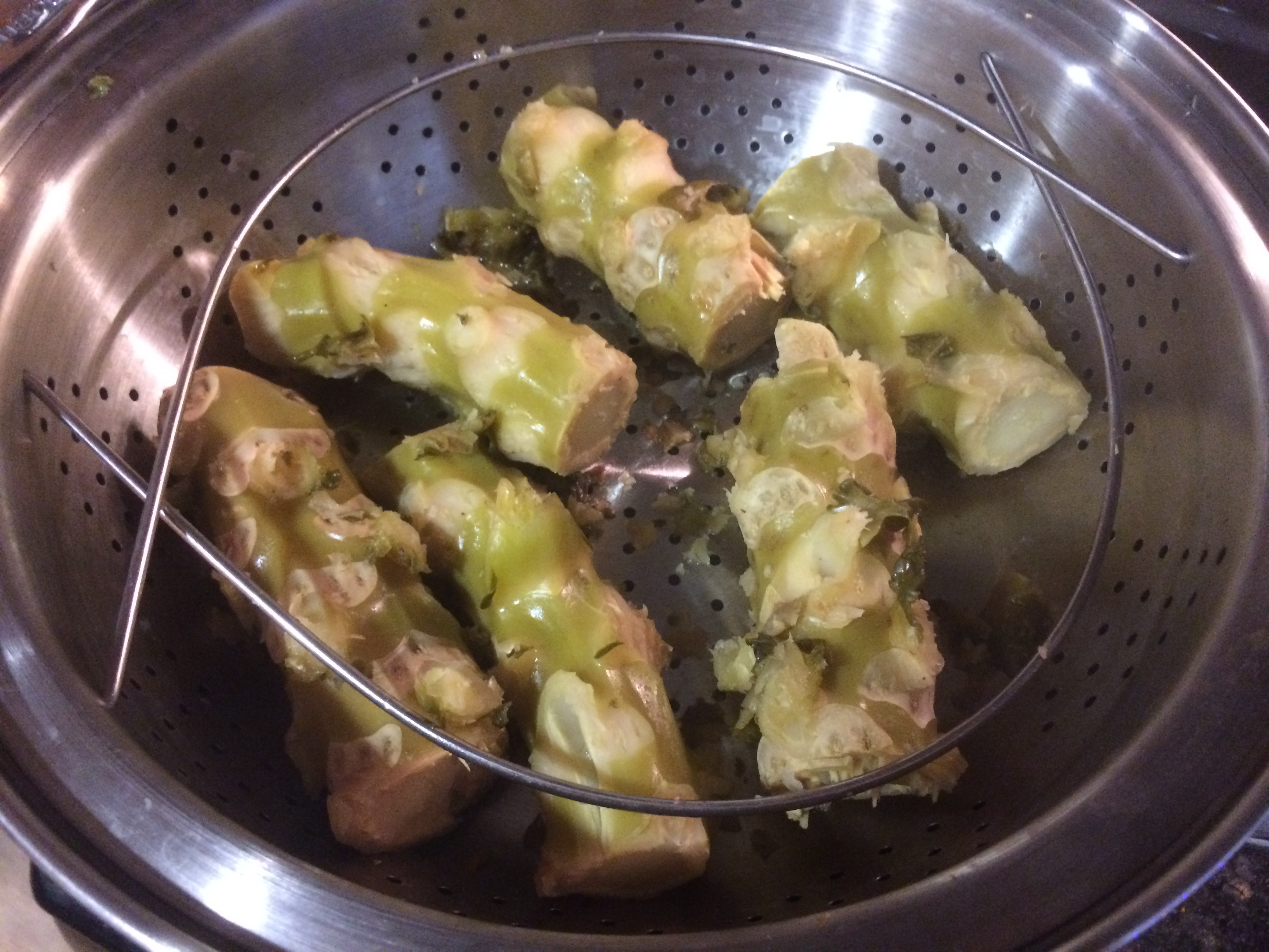 Fully steamed Brussels sprout stalk pieces with split outer layers