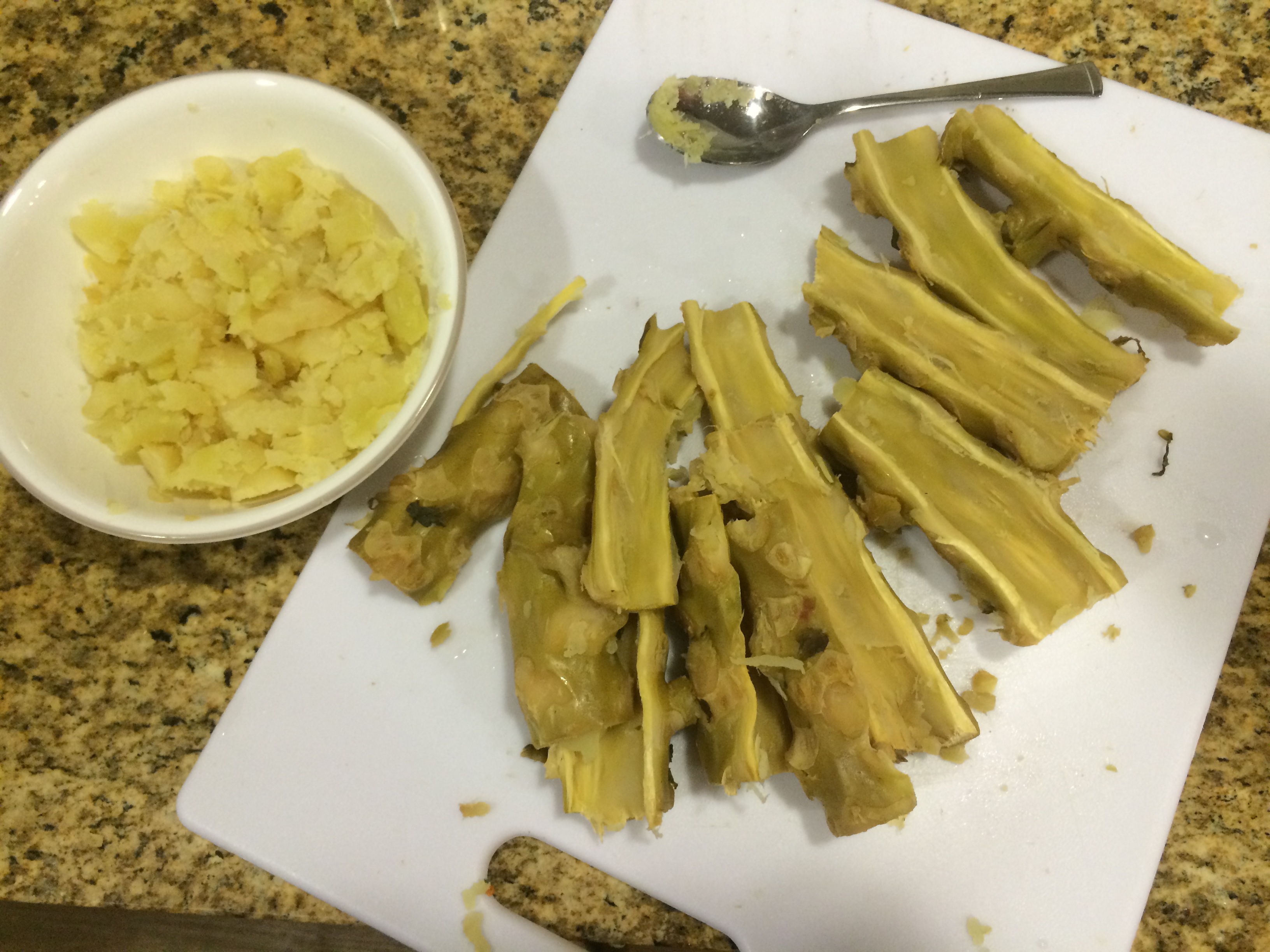 Cooked pith scooped from Brussels sprout stalks into a bowl